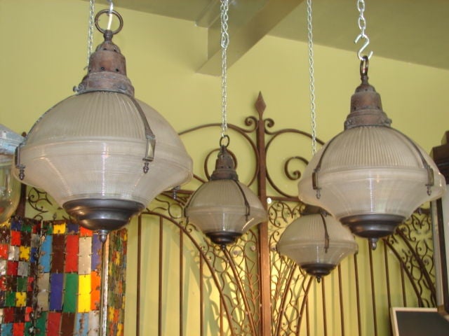 Pair of copper and bronze holophane hanging lights