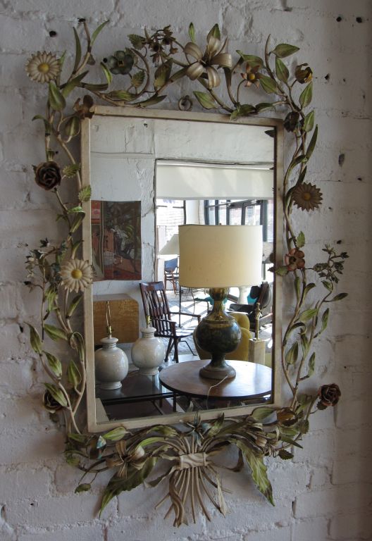 Delicately rendered floral tole frame mirror, just in time for Spring.