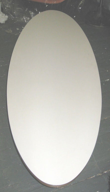 A diminutive ETS surfboard low table with the exact 3:1 proportions and height of the longer model. Probably made by Vitra.  White laminated plywood top and welded and zinc coated steel legs. No markings.