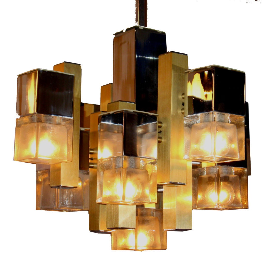 A classic Sciolari chandelier with cubic glass shades pending from chromed cubes.  Brass parts add to the dynamic look of this fixture. Squared bar and canopy.