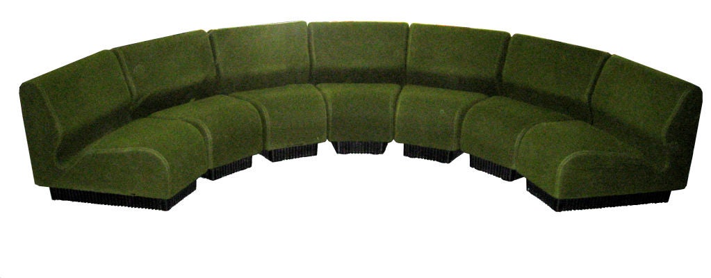 A large, 7 elements, sectional sofa. It can be arranged as a unique piece or several separate chairs. Beautiful original fabric.