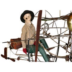 Flying Boy With Pipe on Cycling Contraption