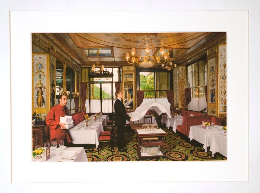 A gorgeous photograph, rich in color and elegance, this image captures an intimate look inside Paris's Le Grand Véfour Restaurant. Its vibrancy lights up any room it's in.<br />
<br />
Le Grand Véfour was the first grand restaurant in the French