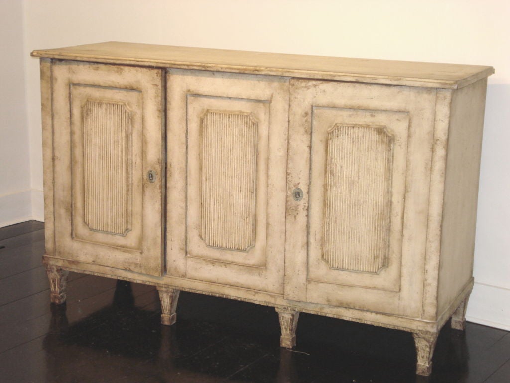 A spectacular, all original, two-piece double glass door cabinet with exquisite details; could actually be used as two separate pieces if desired.