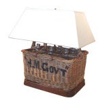 Antique "H.M. Gov't" Basket and Bottle Lamp