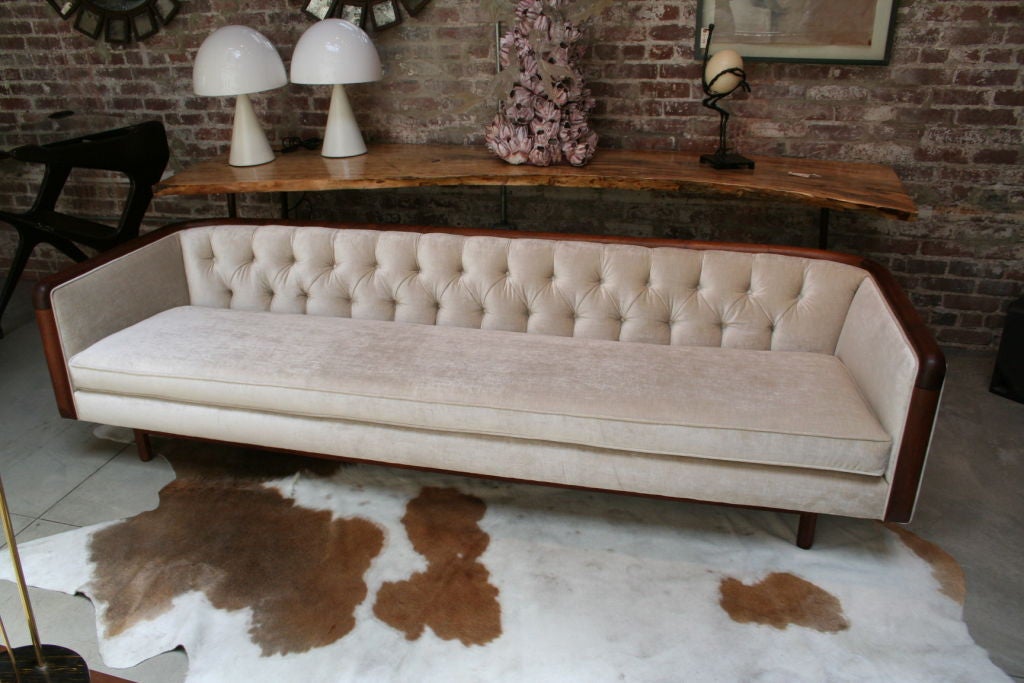 Extra-long 1960's capitone sofa re-upholstered with champagne velvet