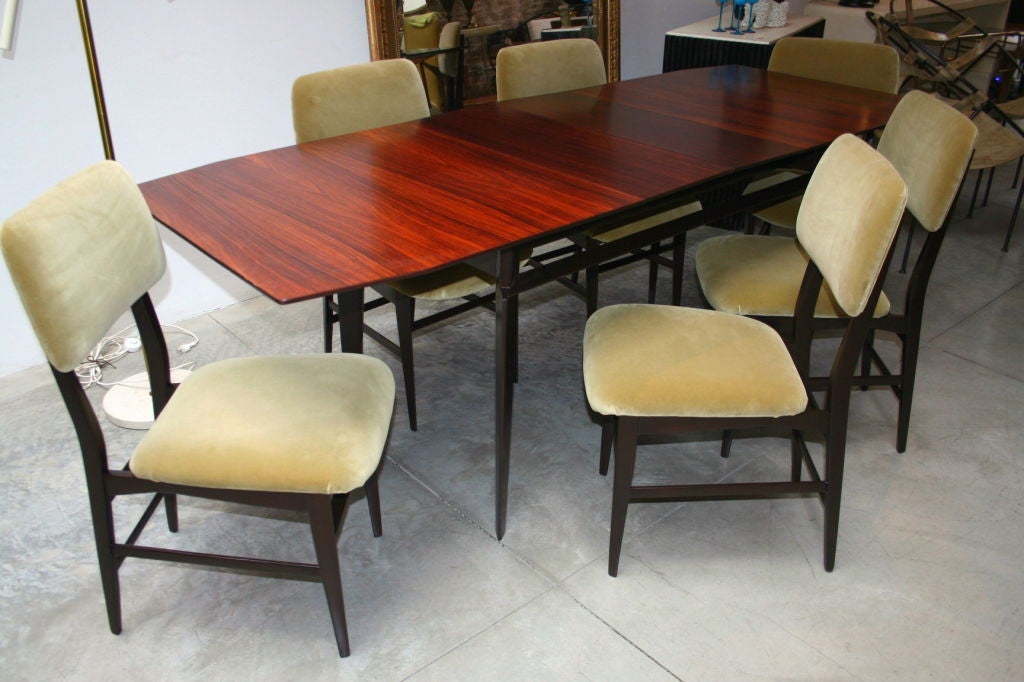 Elegant 50's dining table and six chairs by Vitorio Dassi. The table has two leaves 11 3/4