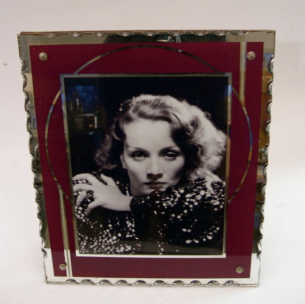 These frames are a part of our current inventory of original art deco table top picture frames in various patterns, colors and sizes. The frames pictured here each hold 8