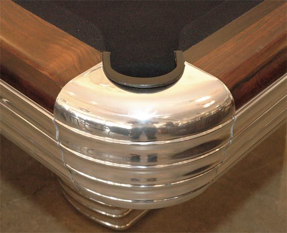 This table was the high end table of it's time designed by R. I. Anderson to celebrate the 100 Year Anniversary of Brunswick. It is beautifully grained walnut with rosewood rails. The slate is a full one inch thick which makes for a smoother, <br