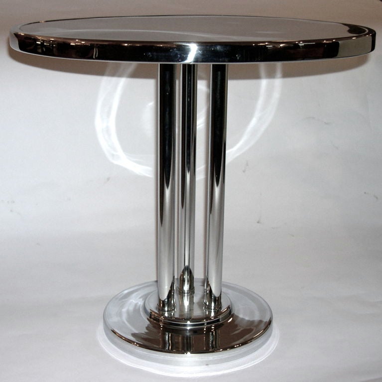 This is a wonderful, original table designed by Wolfgang Hoffman for the Howell Co. in the mid 1930's. It has been completely restored and looks great. The size is perfect for most seating applications. The gloss black laminate top is a very
