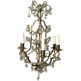 A Small Gilded Metal and Crystal Louis XV Style Chandelier