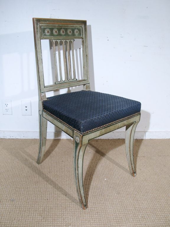 A Set of Eight Louis XVI / Georges Jacob Style Painted Dining Chairs with Front Sabre Legs. Painted in Green with Darker Green Lining, and Upholstered in  Dark Blue Horsehair. In the Manner of Maison Jansen<br />
French, Circa 1940's