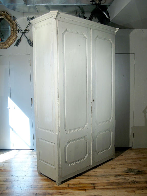 A Tall Green Painted Catalan Armoire with Panelled Doors