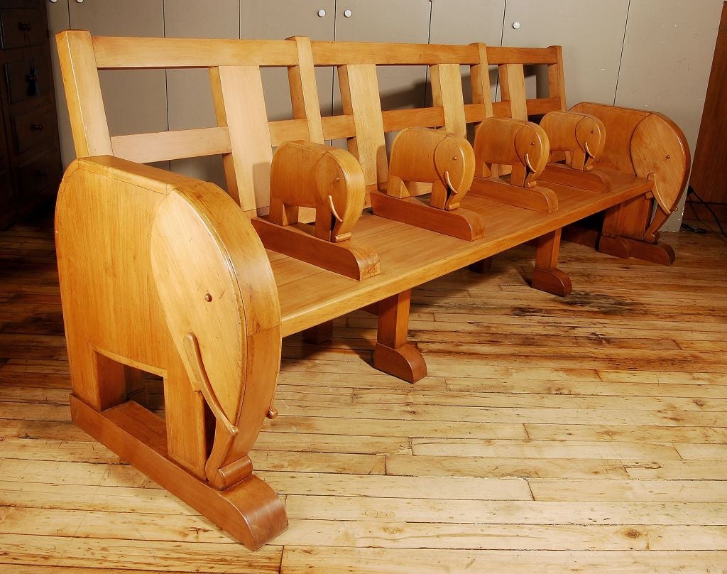 A Long, Low, Wooden Child's Bench With Elephant Motifs