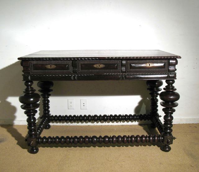 A Portugese Rosewood Center Table with Drawers and Brass Bosses, In the 17th Century Colonial Style
