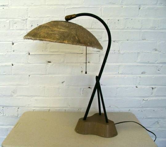 NOTE:  This item located in our Lambertville, NJ  retail store.

Early example of modern lamp design, likely California origin.
Fiberglass shade mounted on black-enameled 