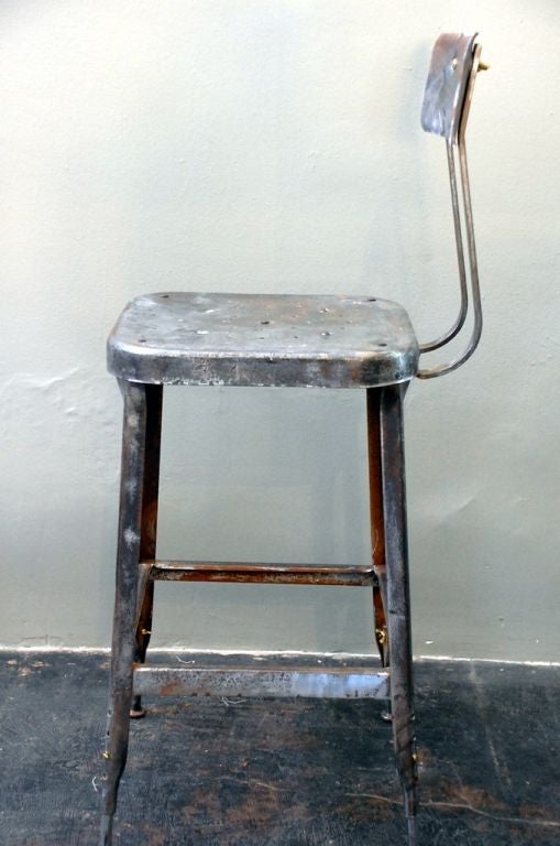 Pair of adjustable industrial bar stools. Seat (21 to 15 in. tall) and back rest adjust.