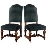 Pair of large sculpted and partially gilt Louis XIV style chairs