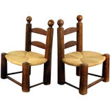 Pair of oak and rush chairs in the style of Charlotte Perriand