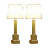 Pair of elegant neoclassical painted metal column lamps