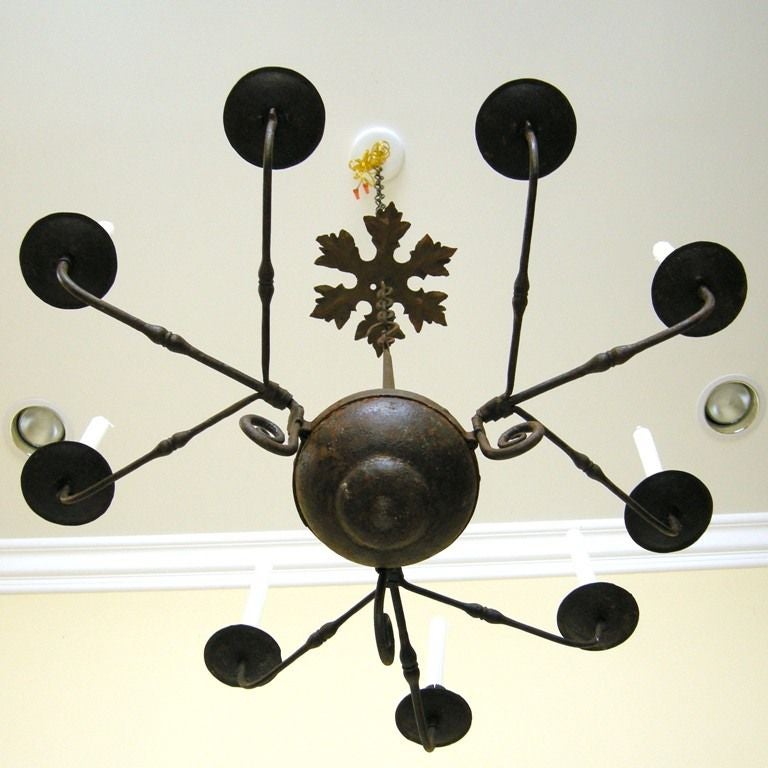 American Colonial Style  Wrought Iron 9-Arm Candle Chandelier.  May be older.  Not-electified/for candle use only.  May have been french wired once as some holes/prep done in past.  Arms can be detached (3 arms per bunch/3 bunches).  Includes links