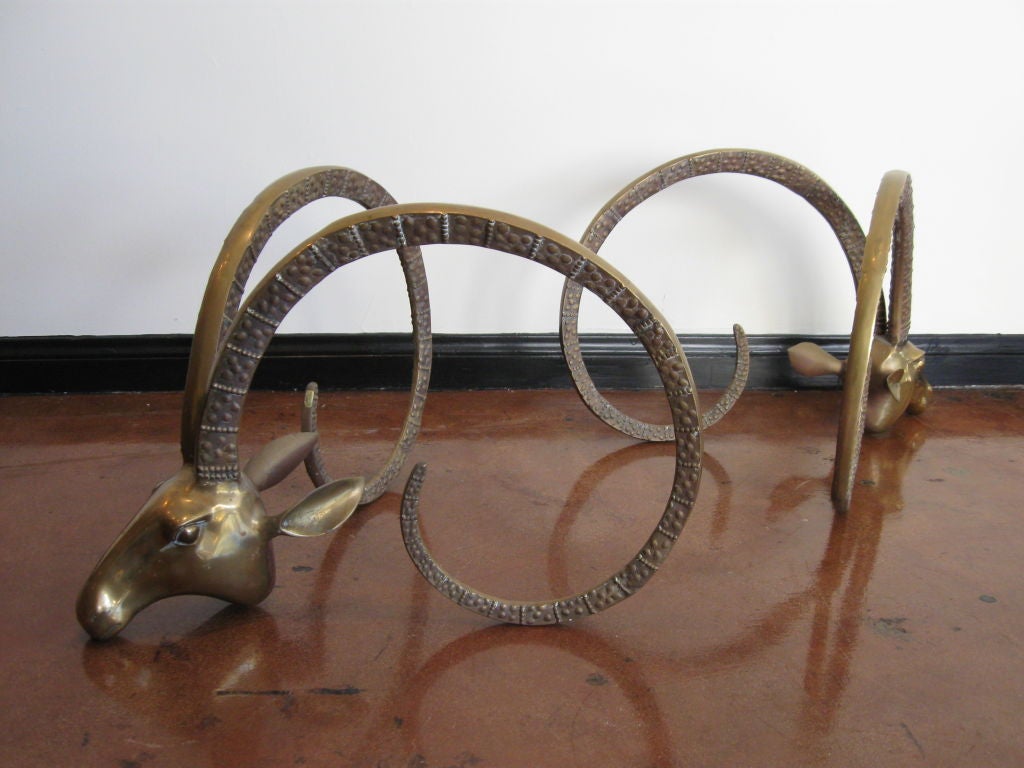 PAIR OF BRASS RAM HEADS