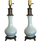 PAIR OF CELADON PORCELAIN AND BRASS OIL LAMPS