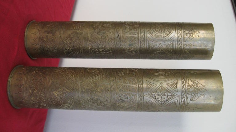 PAIR OF ELABORATELY EMBOSSED AND ENGRAVED BULLETS