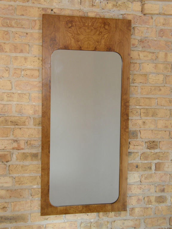 Pair of burled wood wall mirrors with rectangular outer edges and rounded corners on the inner edges