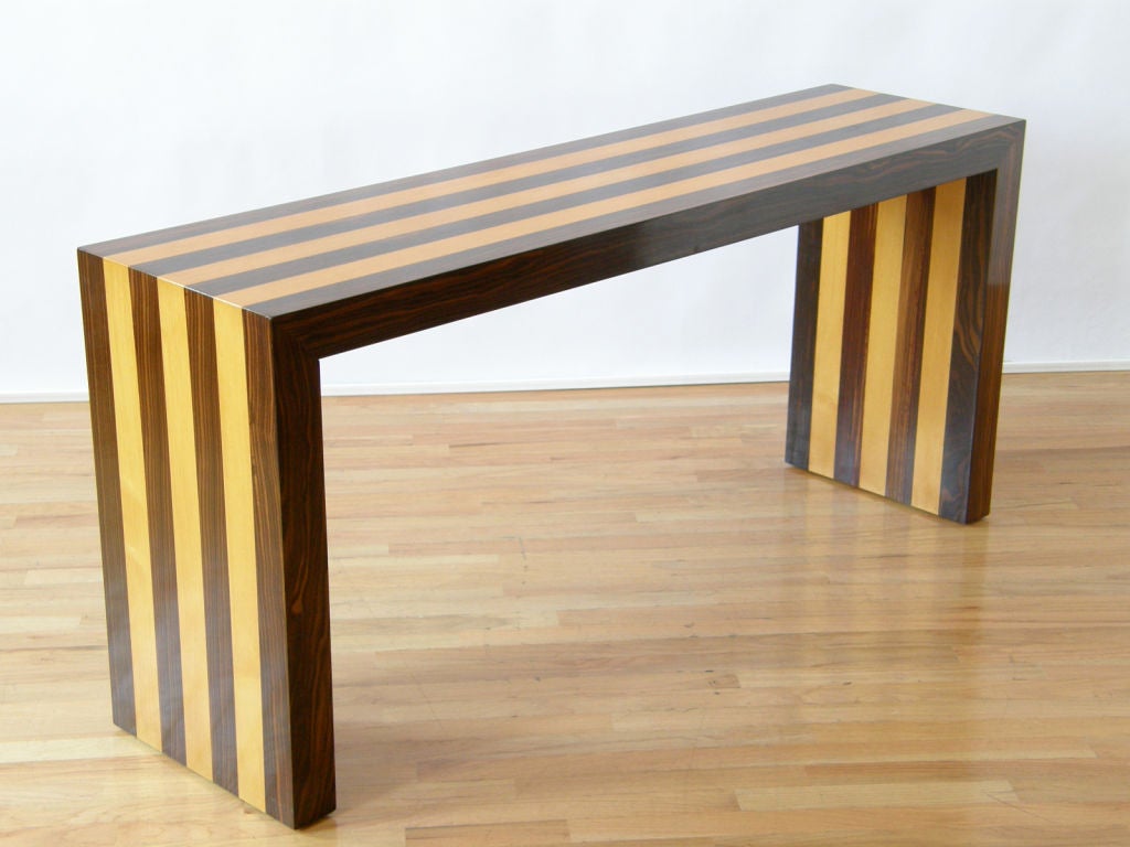 Striped console table of Macassar ebony and pecan attributed to Milo Baughman. <br />
<br />
The table has lost its original label, so we list this as an attribution. Included are photo and description of a similar piece from the 