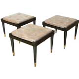 Set of three mahogany and leather stools