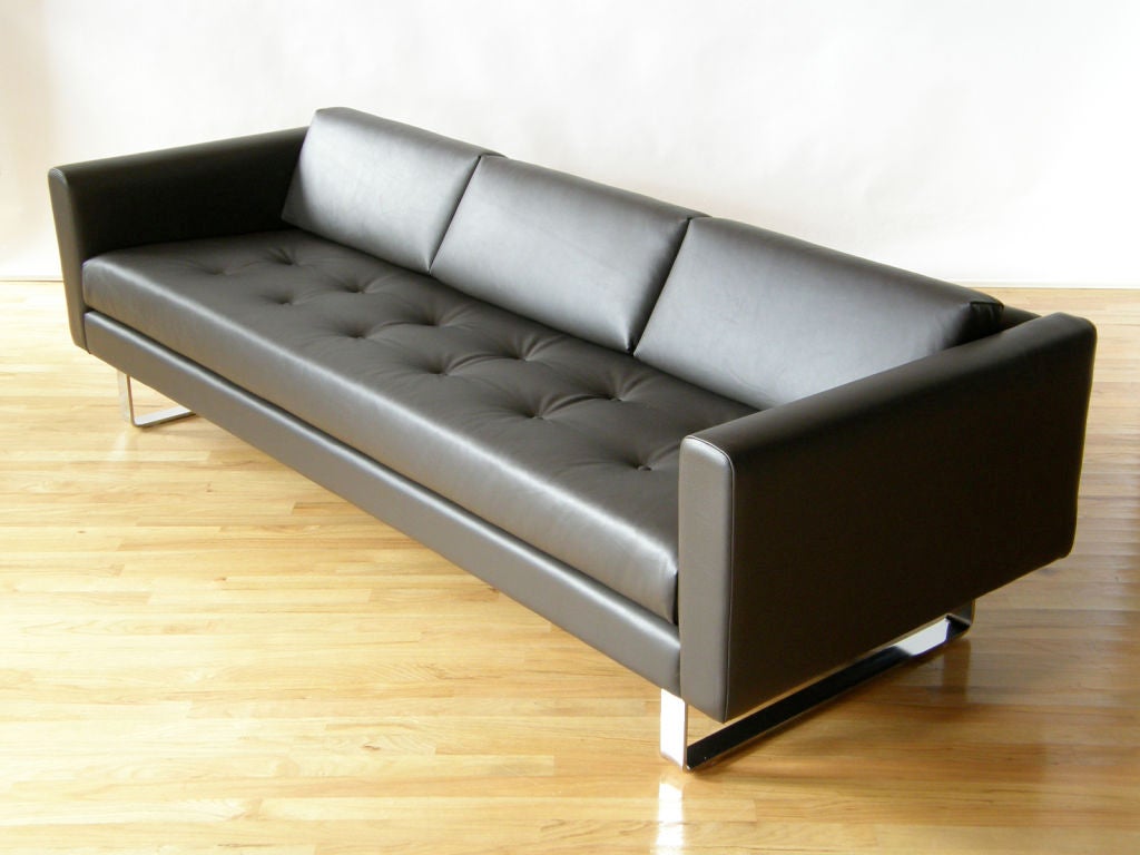 Sleek leather sofa by Directional, probably designed by Milo Baughman. <br />
Bought at The Merchandise Mart in Chicago in the early 1970's. <br />
Recovered in charcoal brown leather.