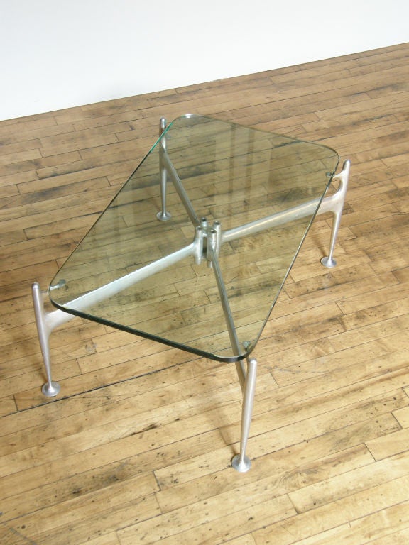 Cast aluminum flexible frame table designed by Alexander Girard. Originally designed as part of a series for Braniff Airlines, the Girard line was only produced by Herman Miller for 1 year. The flexible table was sold with either a rectangular or