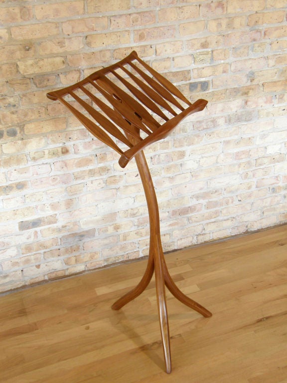 Walnut music stand by Steven Spiro. Beautifully crafted with an organic feel reminiscent of the art nouveau style. Since the early 70's Spiro has been producing furniture and decorative objects from his studio in Wisconsin. His contemporary work is