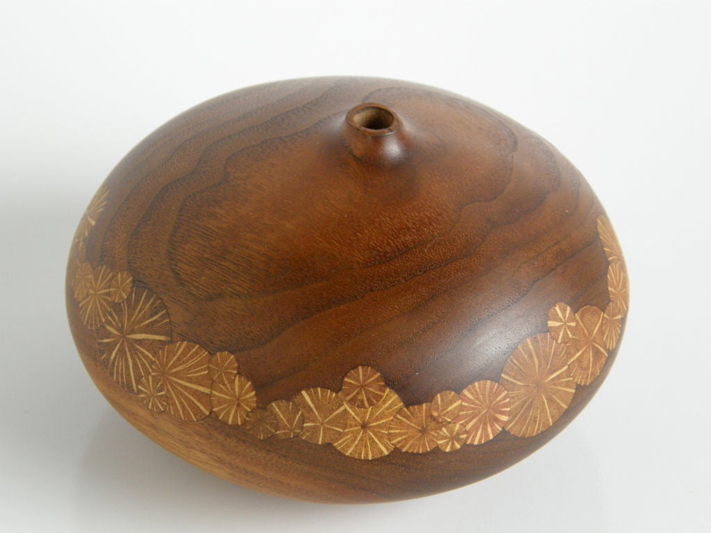 Ovoid walnut twig pot inlaid with oak root cross-sections. Michigan woodworker Roger Sloan's pieces have been featured in Fine Woodworking magazine.

Please contact us if you have any questions.