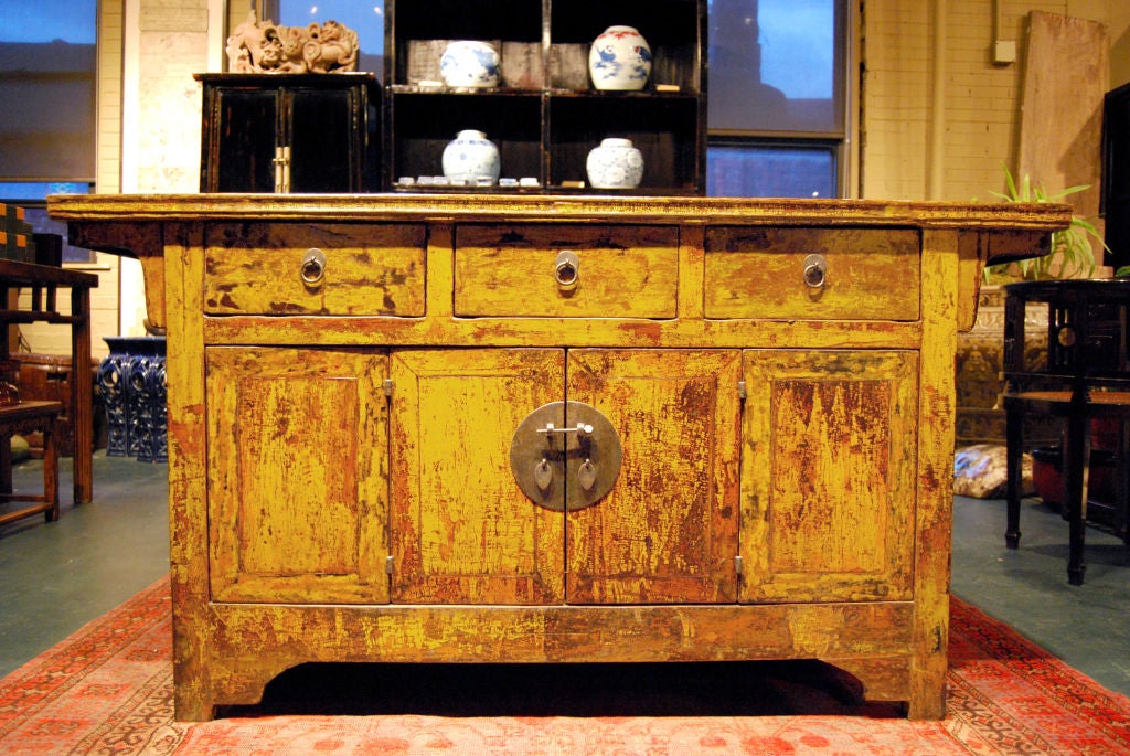 Unusual yellow lacquer coffer with three drawers, bi-folding doors, and round brass hardware from Northern China.<br />
<br />
Pagoda Red Collection #:  CAF002<br />
<br />
<br />
Keywords:  Sideboard, buffet, server, credenza, console, entry