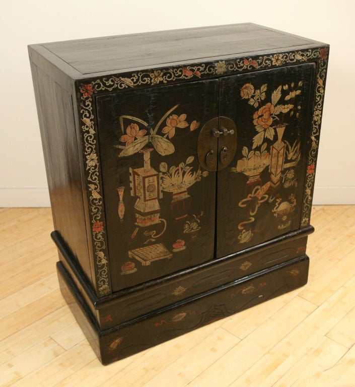 Pair of provincial 19th century Chinese lacquered chests with folk paintings depicting traditional vases with pomegranates, peonies, and lotus blossoms, amongst other Scholars' studio objects.<br />
<br />
Pagoda Red Collection #:  DVA046<br
