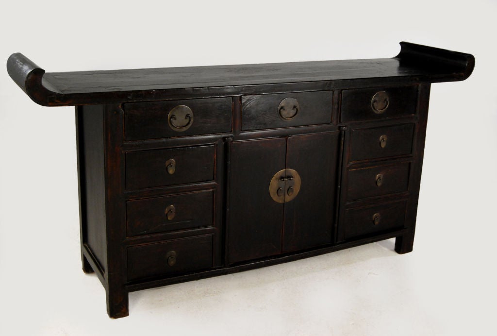 A 19th century Chinese elmwood coffer with nine drawers, two doors, original black lacquer, and brass hardware from China's wealthy Shanxi Province.<br />
<br />
Pagoda Red Collection #:  T063<br />
<br />
<br />
Keywords:  Sideboard, buffet,