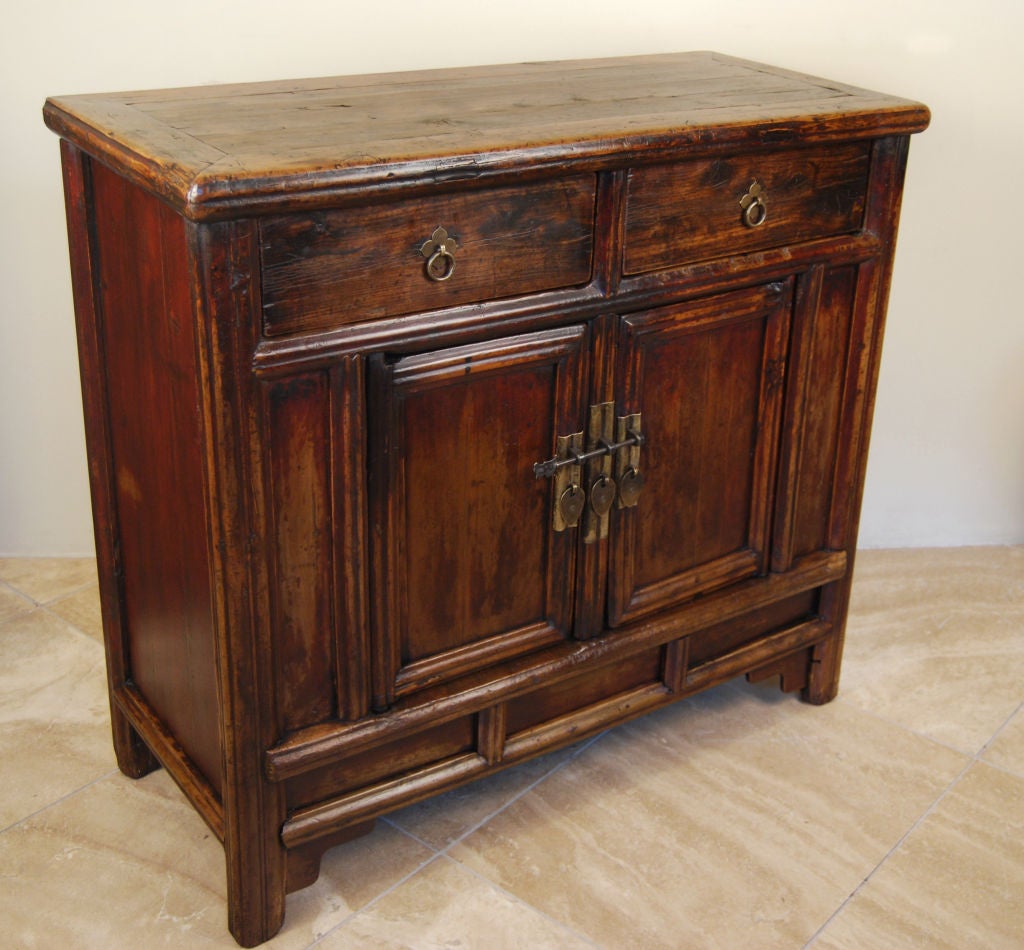 Chinese elmwood side cabinet with two drawers and two doors, wih brass hardware from 19th century provicial China.<br />
<br />
Pagoda Red Collection #:  W100<br />
<br />
<br />
Keywords:  Side table, cabinet, chest of drawers, dresser,
