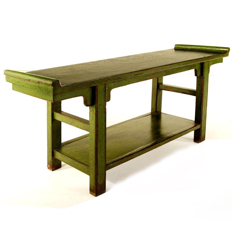 A 19th century provincial Chinese altar table with flanked top, and a shelf below, with a vintage green lacquer.<br />
<br />
Pagoda Red Collection #:  X018<br />
<br />
<br />
Keywords:  Table, console, sofa table, sideboard, buffet, server,