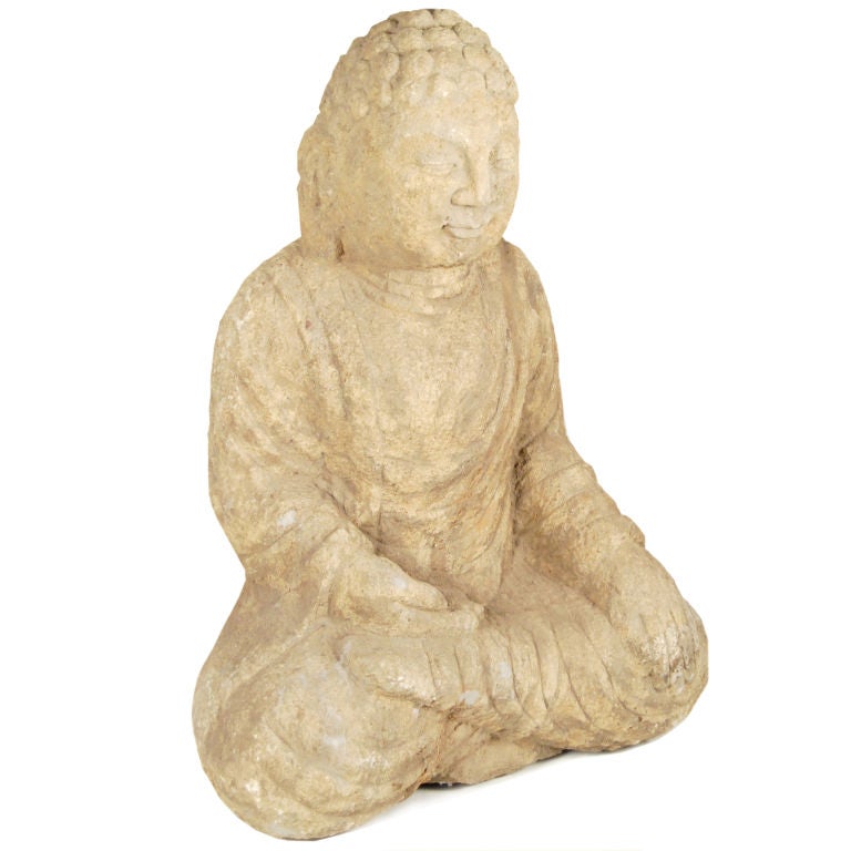 A grand 20th century carved limestone seated Buddha in the 