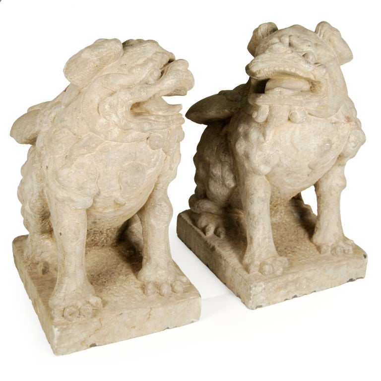 Gazing at the moon, this pair of carved limestone Fu dogs is uniquely equipped with wings to take flight. Originally, they were positioned to protect the exterior of a 19th century Chinese courtyard home.<br />
<br />
Pagoda Red Collection #: 