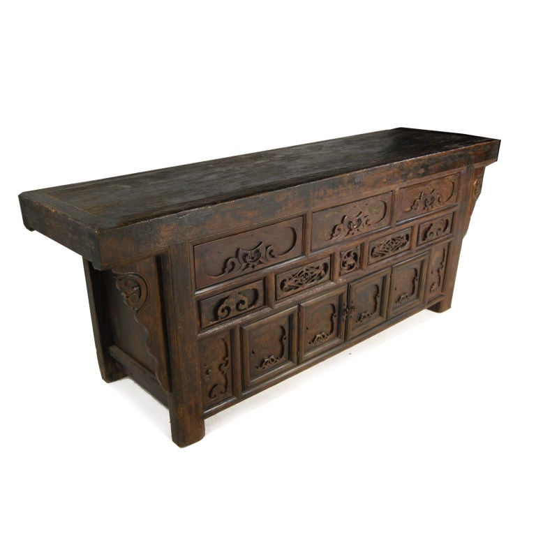 A 19th century provincial Chinese elmwood altar coffer with three highly carved drawers and two doors below.<br />
<br />
Pagoda Red Collection #:  GDI003<br />
<br />
<br />
Keywords:  Coffer, sideboard, server, buffet, credenza, sofa table,
