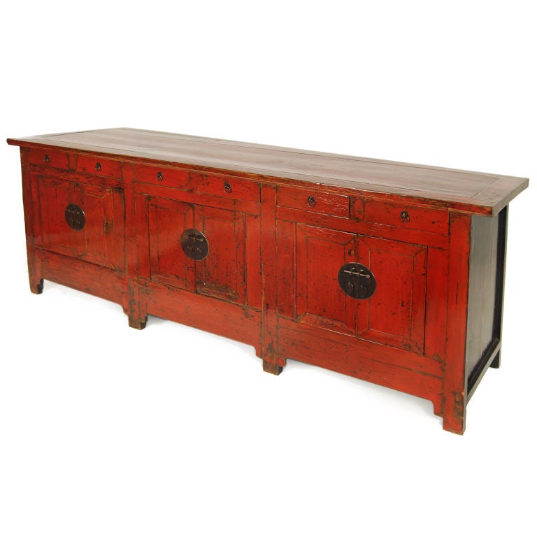 A 19th century red lacquered Chinese elmwood coffer with six drawers and six doors, with traces of original layers of lacquer preserved under a clear lacquer finish and brass hardware.<br />
<br />
Pagoda Red Collection #:  CAE123<br />
<br