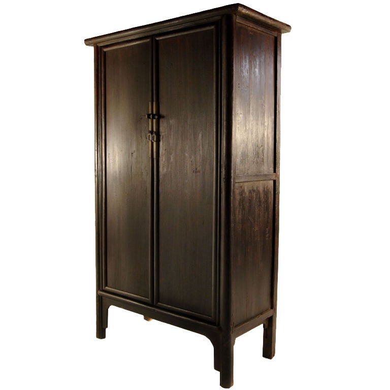 A 19th century Chinese elmwood cabinet with two doors and two drawers with brass hardware.<br />
<br />
Pagoda Red Collection #:  X075<br />
<br />
<br />
Keywords:  Cabinet, armoire, closet, storage, cupboard