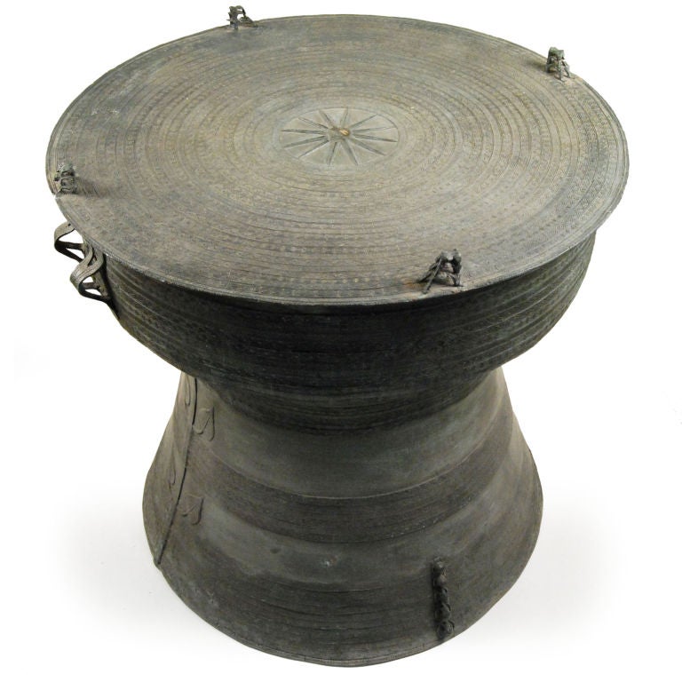 In addition to being symbols of great wealth, Dong Son drums from the 1st millenium BCE were used in religious ceremonies, as well as by many Southeast Asian groups in order to detour invading enemies. This version is cast of bronze with a green