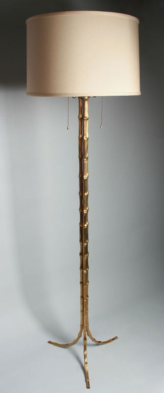 This is one of the nicer bamboo floor lamps we have seen and is possibly done by Maison Baguès.
