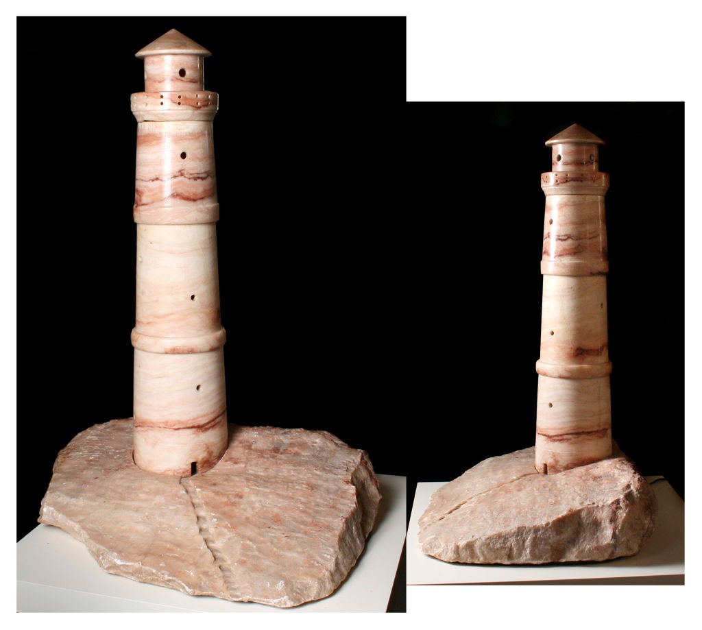 This is a wonderful piece.  When lit, it casts a warm rosy glow.  This is perhaps the largest lighthouse lamp we've ever seen.  the details are wonderful, including the steps up to the door.