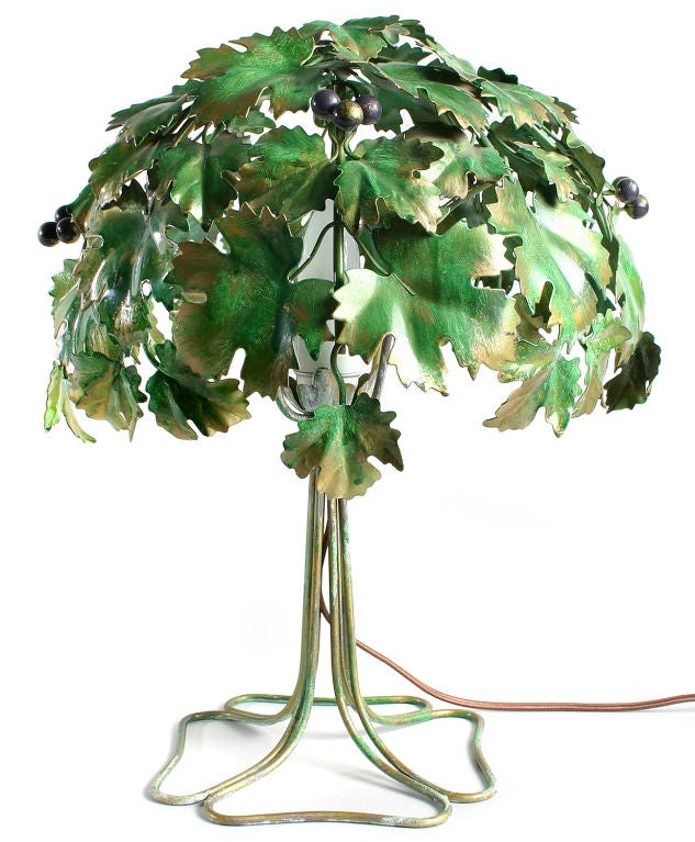 A wonderful and whimsical lamp composed of metal leaves and berries.  Casts a fabulous shadow when lit.