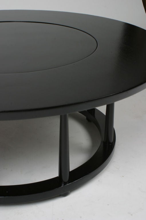 T. H. Robsjohn Gibbings cocktail table, center with lazy susan. circular base with tapered dowel supports.